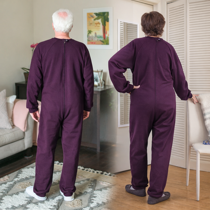 Two people wearing purple Alzheimer's clothing in a home setting.