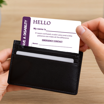 Person holding a black wallet with a disability awareness card inside